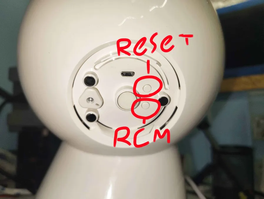 Back panel of Jibo's head showing the micro-USB port at the top, the Reset button (upper circle), and the RCM button (lower circle)